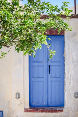 Old house and blue door at Emporio village of Santorini island in Greeceの写真素材