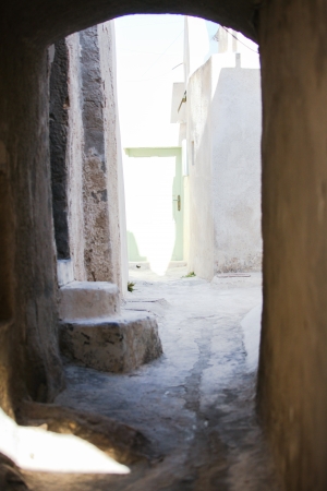 Village houses with old staircases in greek town at Santorini islandの写真素材