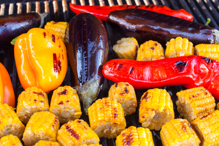 Close-up of  Vegetarian barbecue and cobs corn on the grill outdoorsの写真素材