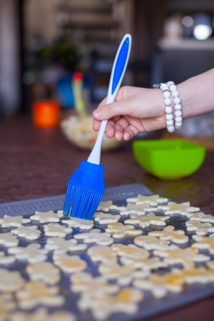 Christmas gingerbread men on a baking brush smearsの写真素材