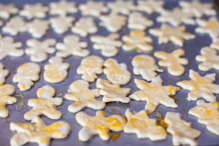 Christmas gingerbread men on a bakingの写真素材