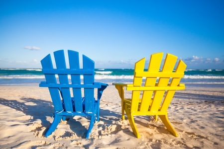 Beach wooden colorful chairs for vacations and summer getaways in Tulum, Mexicoの写真素材