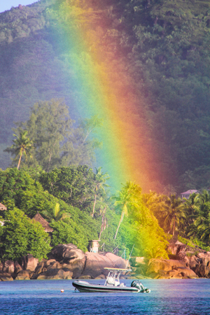 Big Rainbow over tropical island and luxurious hotelの写真素材