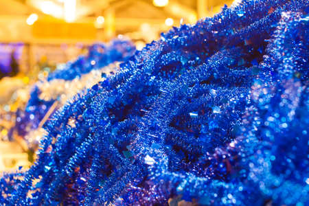 Bunch set of bright christmas garlands in supermarketの写真素材