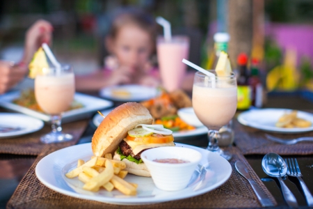 Burger and fries on white plate for lunchの写真素材