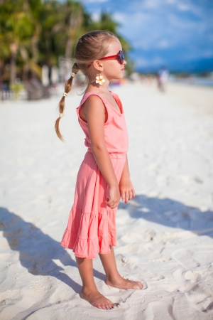 Adorable little girl on tropical beach vacationの写真素材