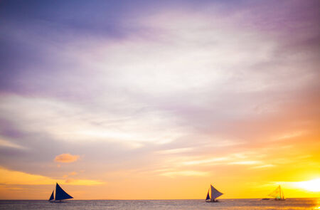 Sailing boat to the sunset in Boracay island on Philippinesの写真素材