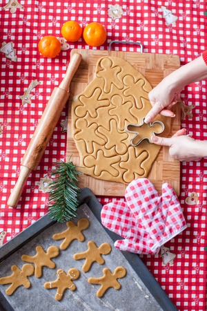 Hands making from dough Christmas gingerbread manの写真素材