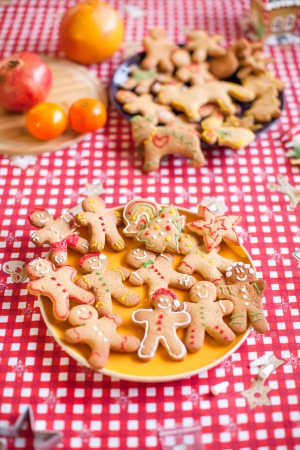 Ready Christmas gingerbread cookies on a white plateの写真素材