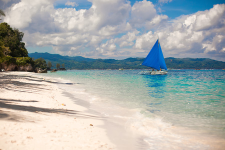 Small boat in open sea on the island of Boracayの写真素材