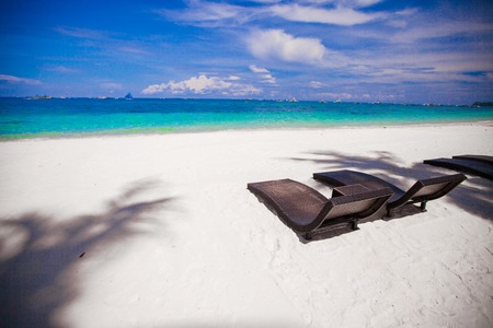 Beach Chairs on beautiful island in white sand plageの写真素材