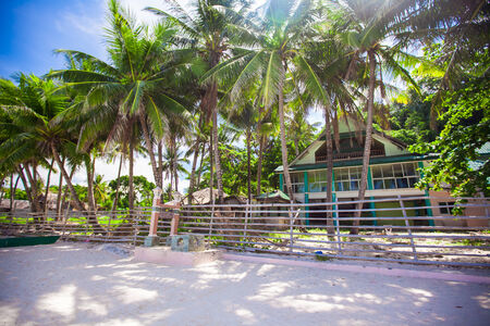 Abandoned and deserted hotel in the jungle on white beach