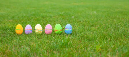 Colored colorful easter eggs in the grass