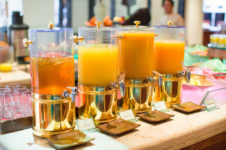Fresh juice at buffet restaurant on breakfastの写真素材