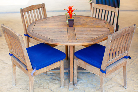 Open-air cafe with white table and chairs near poolの写真素材