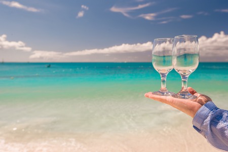Two clean glasses on background of turquoisr seaの写真素材
