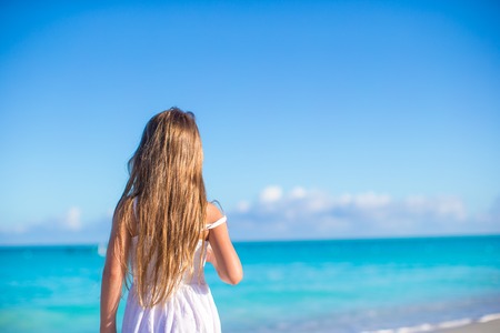Adorable little girl at beach during summer vacationの写真素材