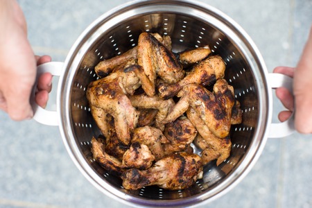 Closeup of grilled meat in a metal panの写真素材