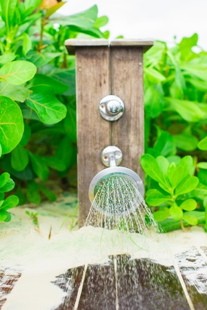 Close up tropical outdoor beach shower at exotic resortの写真素材