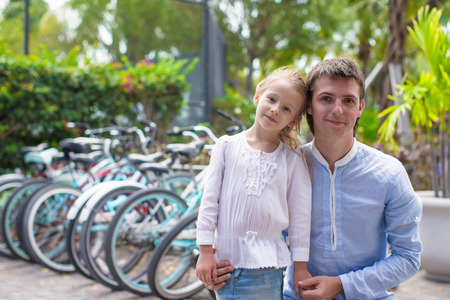 Young dad and his little daughter on an tropical resortの写真素材