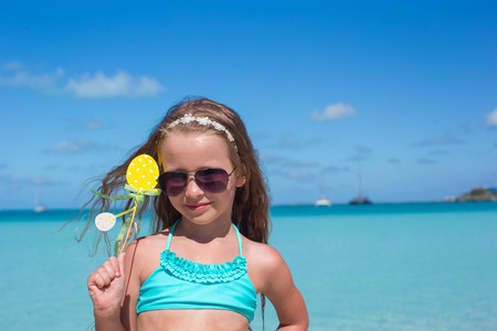Adorable little girl at beach during summer vacationの写真素材