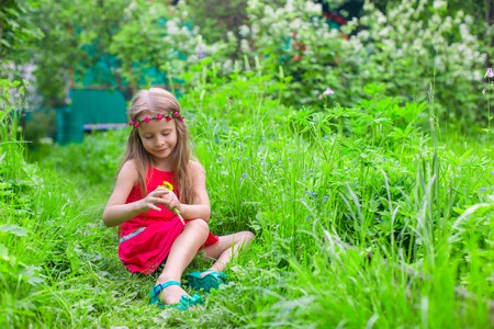 Portrait of adorable little girls on a warm summer dayの写真素材