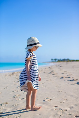 Cute little girl at beach during summer vacationの写真素材