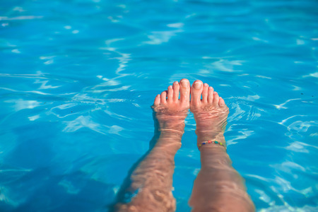 Close up of a woman's foot in the water