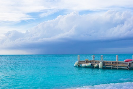 Perfect white beach with pier at caribbean island in Turks and Caicosの写真素材