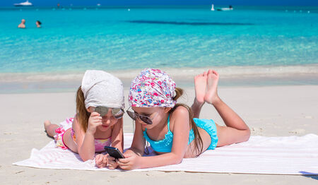 Little girls in the white beach and having funの写真素材
