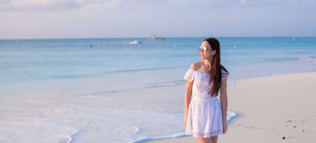 Young beautiful woman at shallow tropical waterの写真素材