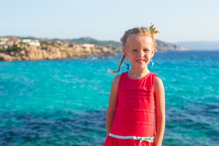 Adorable little girl at tropical beach during summer vacationの写真素材