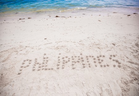 Philippines written in sandy tropical beachの写真素材
