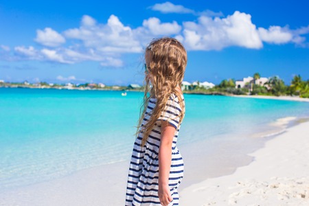 Adorable little girl at beach during summer vacationの写真素材