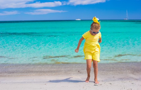 Adorable little girl at white beach during summer vacationの写真素材