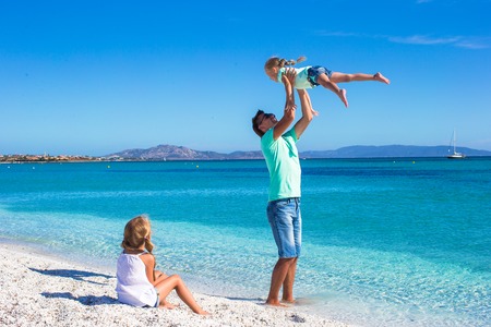 Father and two kids during their tropical vacationの写真素材