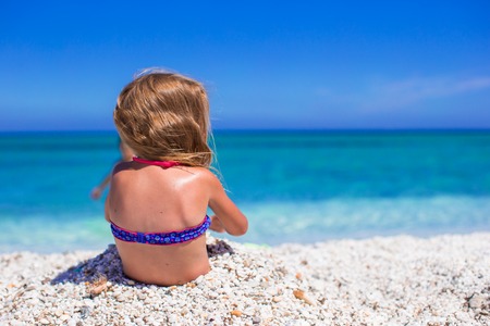 Adorable little girl at tropical beachの写真素材