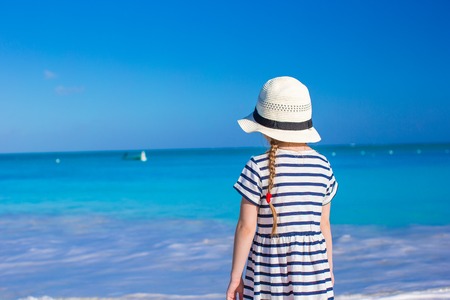 Adorable little girl at white beach during summer vacationの写真素材