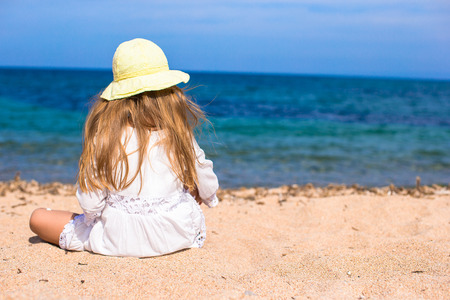 Adorable little girl at tropical beach during vacationの写真素材