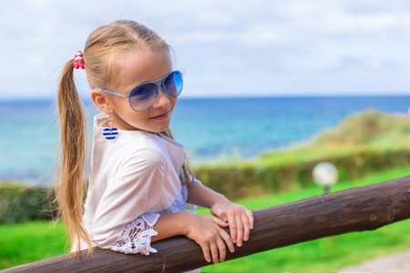 Adorable little girl outdoors during summer vacationの写真素材