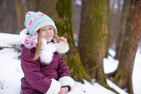 Adorable little happy girl have fun during winter vacationの写真素材