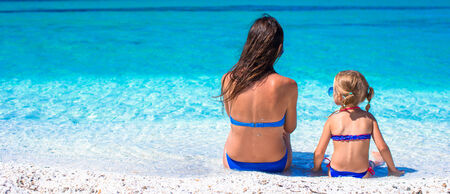 Little cute girl and happy mom during summer vacationの写真素材