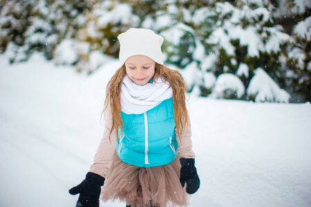 Portrait of adorable little girl outdoors on winter dayの写真素材