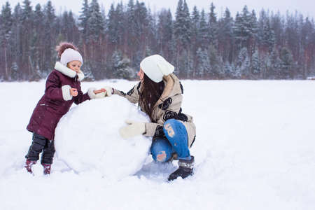 Happy family enjoy winter snowy dayの写真素材