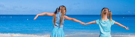 Little adorable girls during tropical summer vacationの写真素材