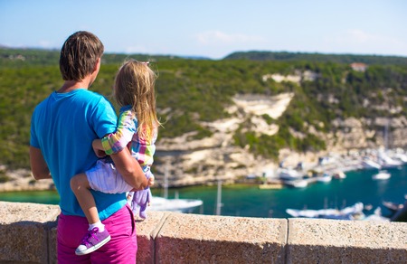 Father and little daughter outdoors in European cityの写真素材