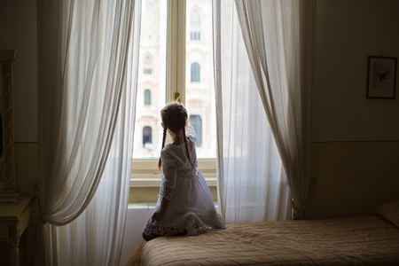 Adorable little girl on rooftop of Duomo, Milan, Italyの写真素材