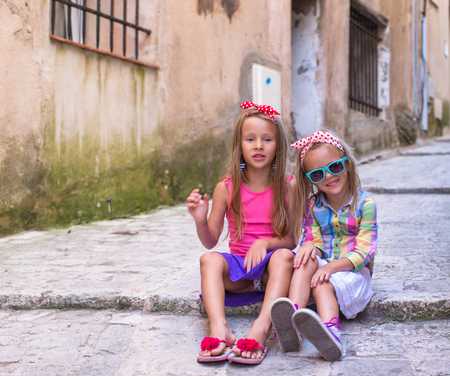 Adorable little girls outdoors in European cityの写真素材