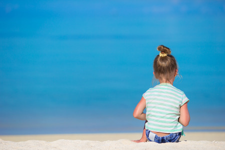 Adorable little girl at beach during summer vacationの写真素材