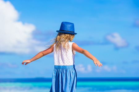 Adorable little girl at beach during summer vacationの写真素材